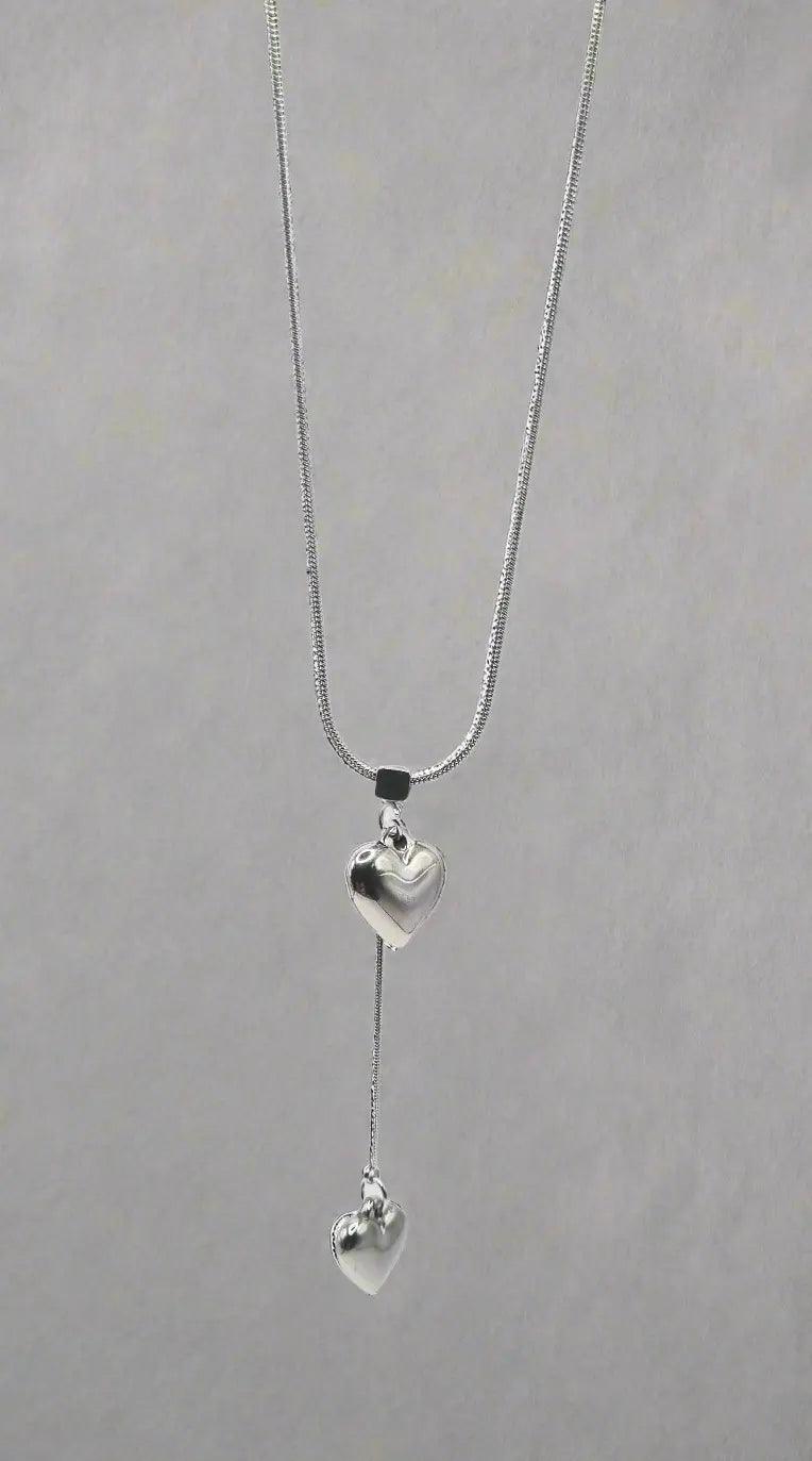 Halskette mit kleinem und langem Herzanhänger - König Jewelry